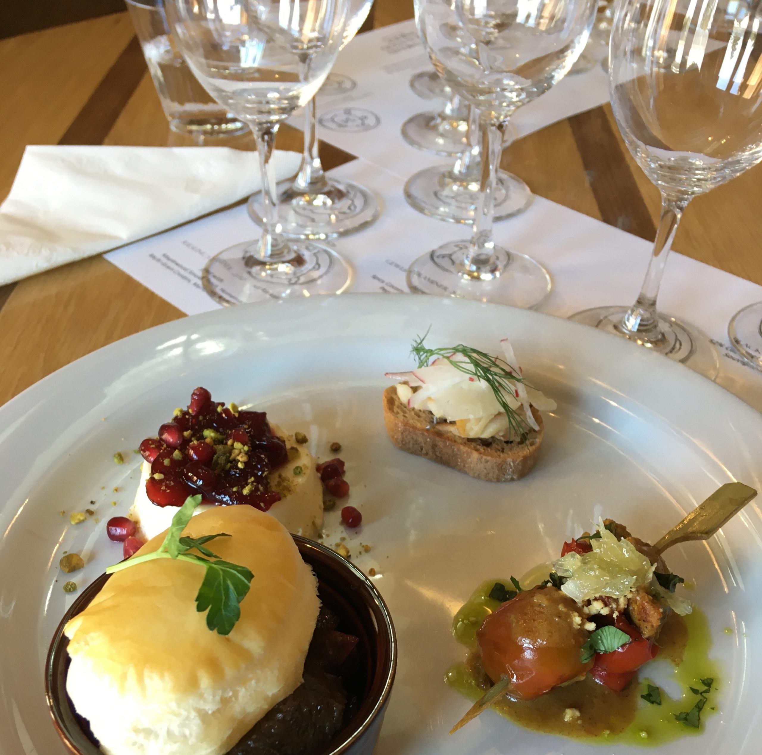 Cropped image of food and wine glasses.