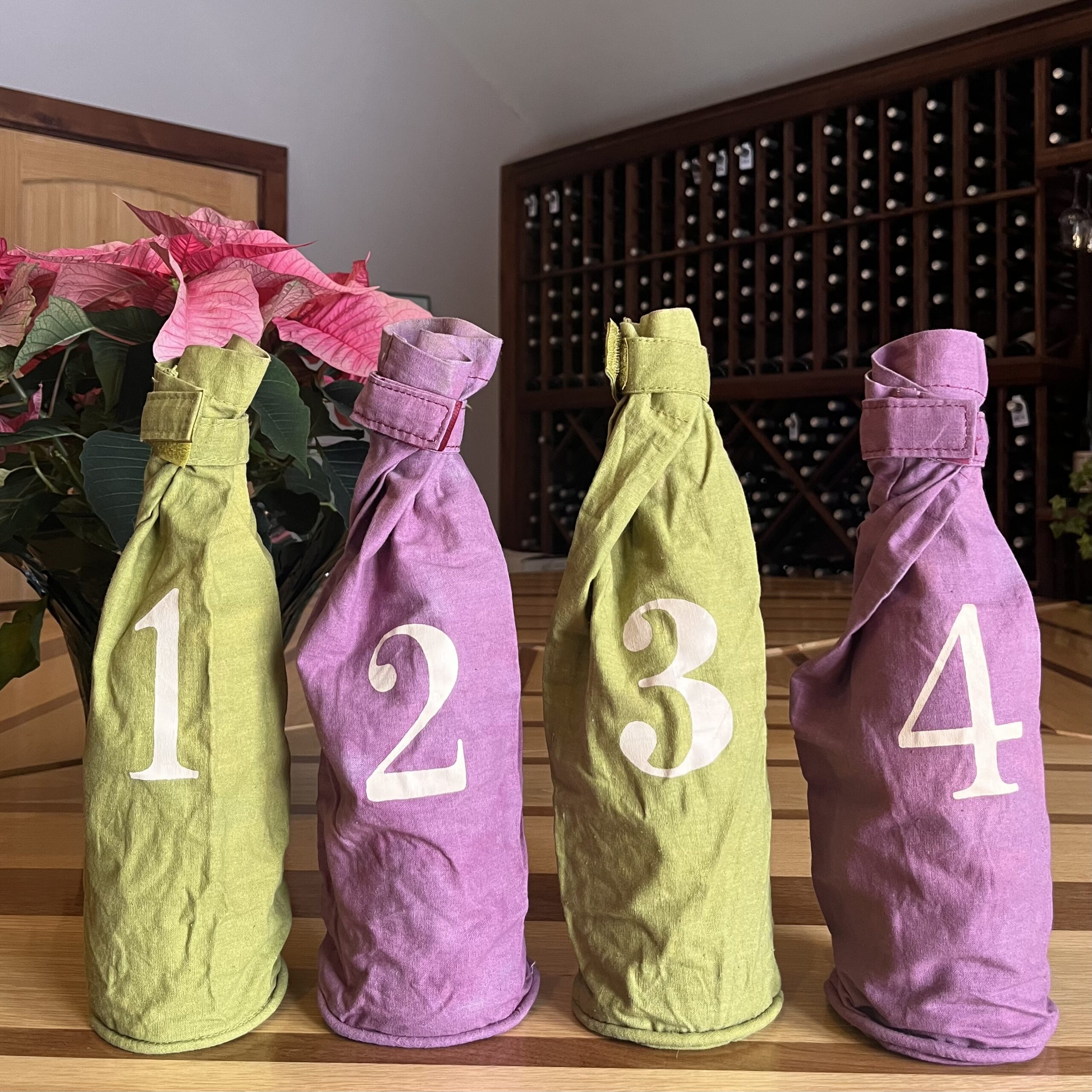 Wine bottles in numbered bags.