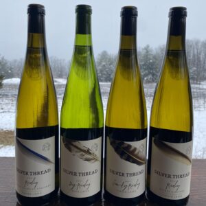 four bottles of riesling