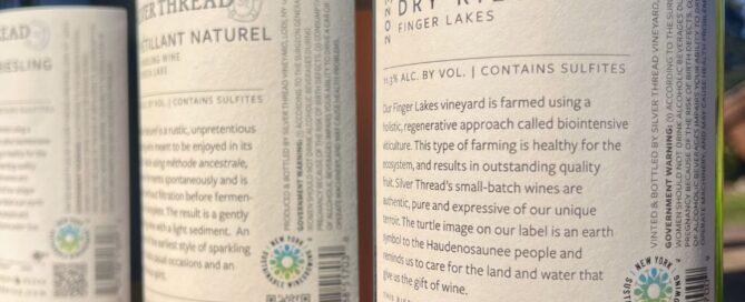 Back labels on wine bottles featuring trustmark