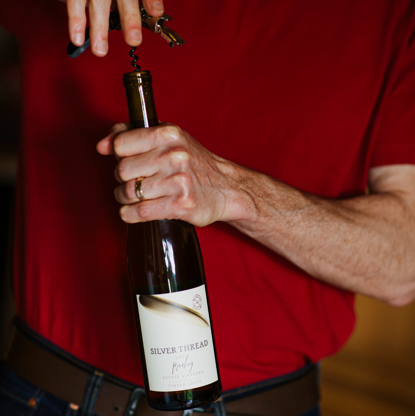 A bottle of Riesling being opened.