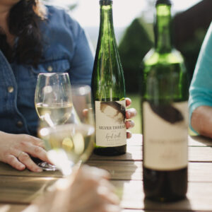 Wine bottles on a table.