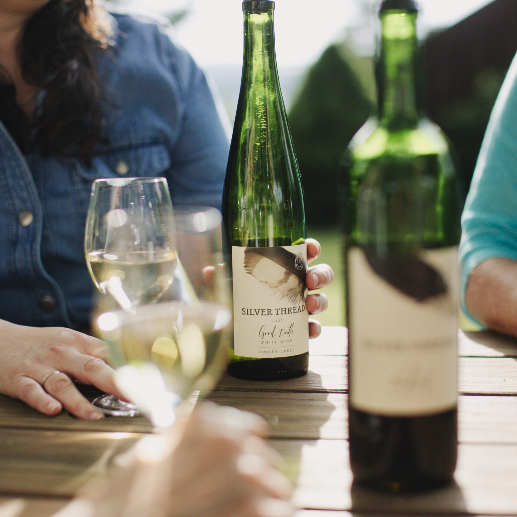 Wine bottles on a table.