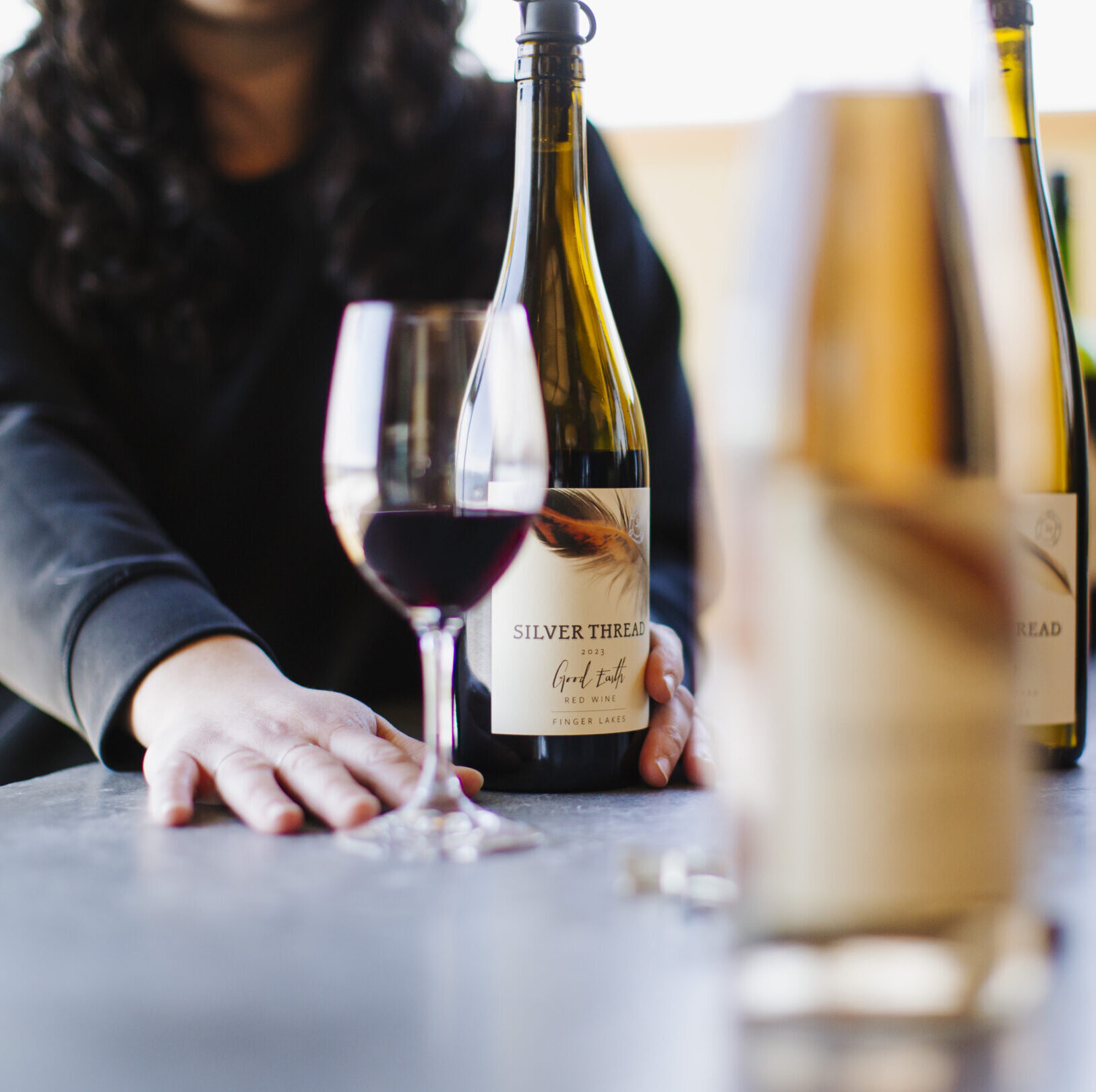 Bottles and glasses on counter.