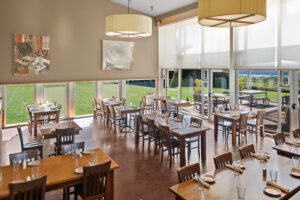 New tasting room space with tables and chairs.