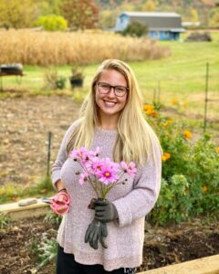 Sydney Fee picking flowers.