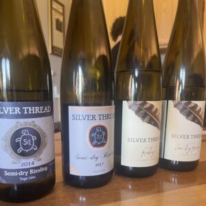 Four bottles of semi-dry Riesling.